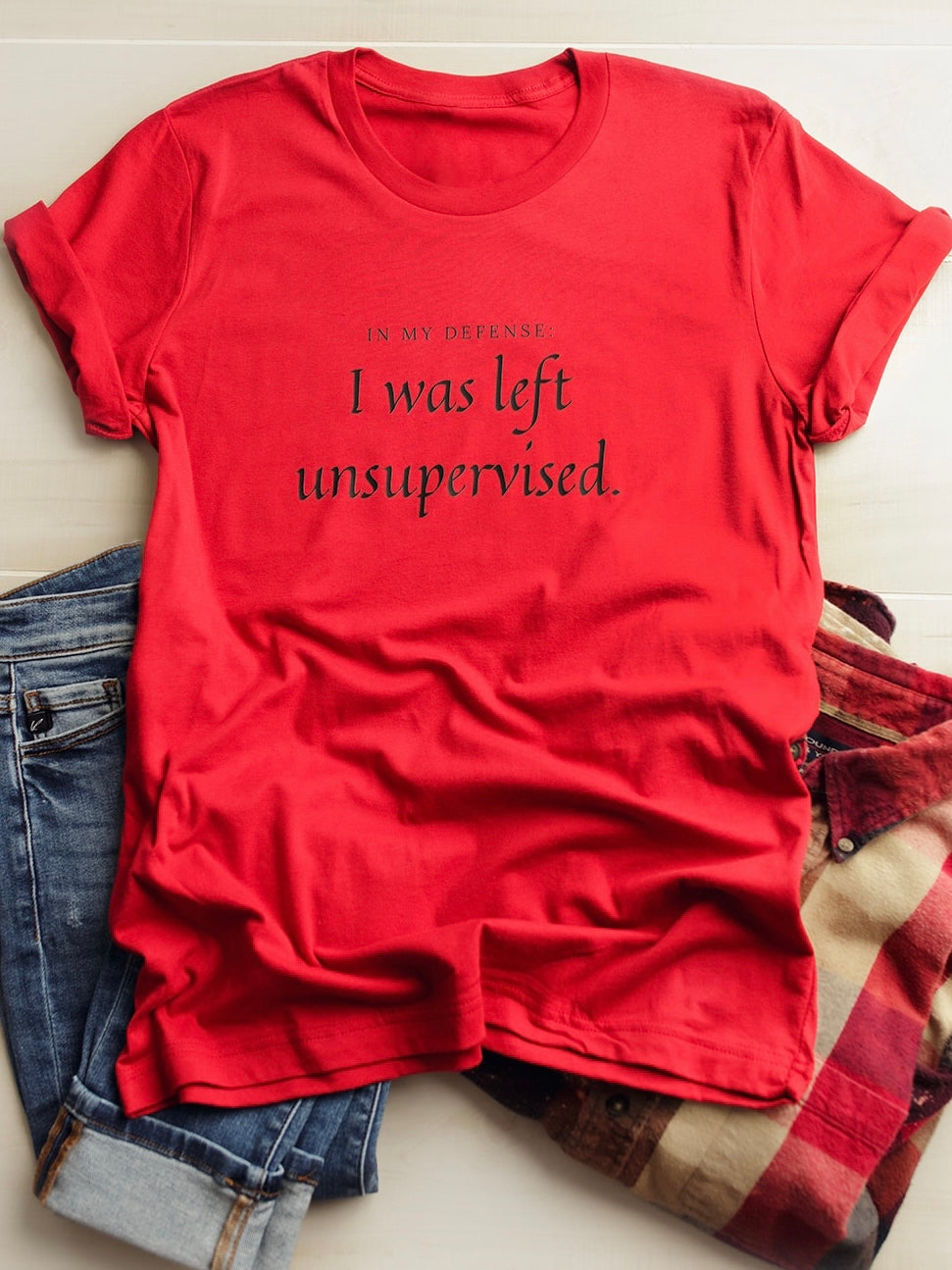 Red Bella Canvas Tee that says In My Defense: I was left unsupervised.