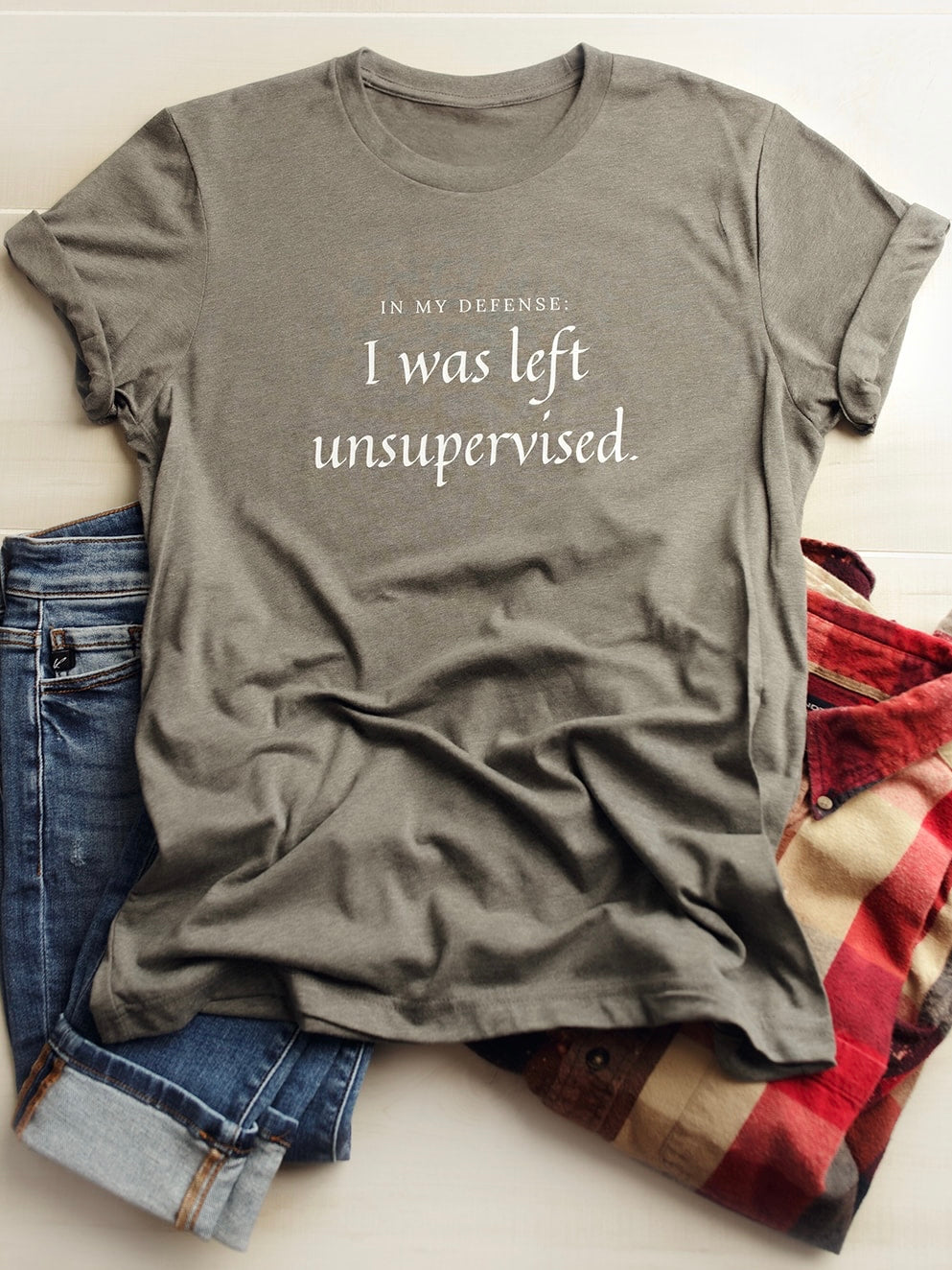 Gray Bella Canvas Tee that says In My Defense: I was left unsupervised.